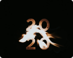 Black background image with fire and the number 20 stacked on each other for the year 2020.