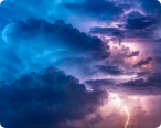 Blue, purple, and pink clouds with lighting strike in the bottom right corner.